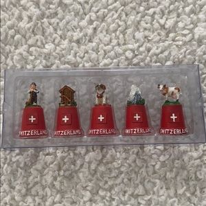 Authentic Switzerland thimbles. New in Plastic
